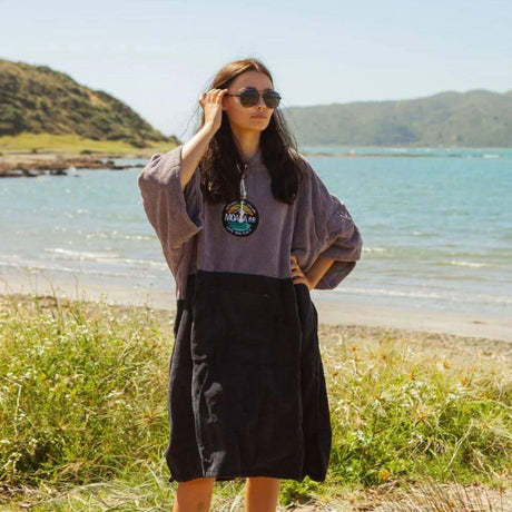 Woman wearing a hooded beach towel