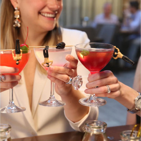 ladies toasting with glasses with novelty drink markers