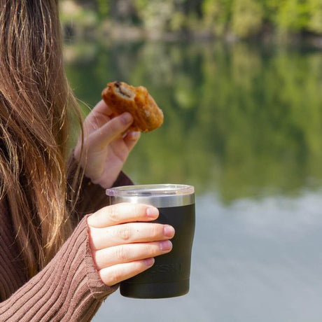 woman holding eco mug