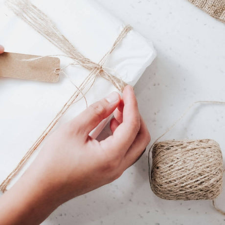 hand wrapping a gift