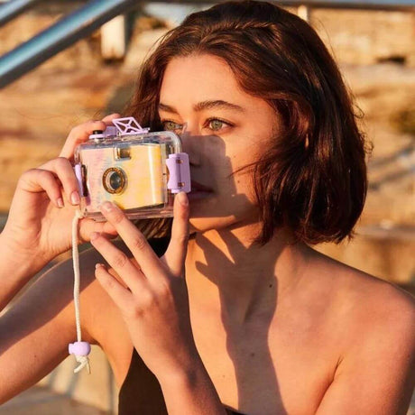 Young woman with camera