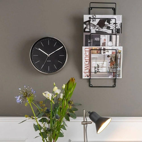 Clock, lamp and news rack home setting