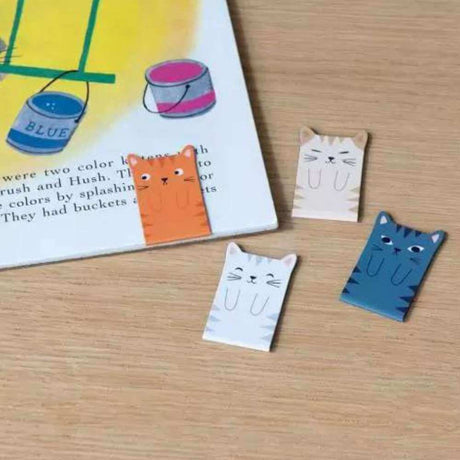 Fun cat bookmarks on book