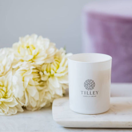 Tilley Vanilla Bean Candle with Flower on a Stone top