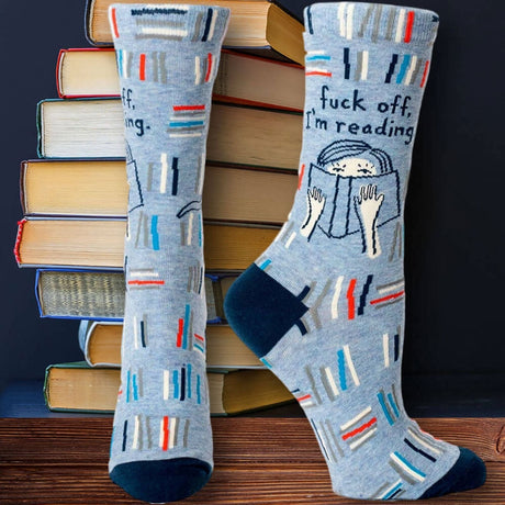 blue q womens reading socks in front of books