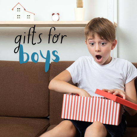 Boy looking excited opening a gift box 