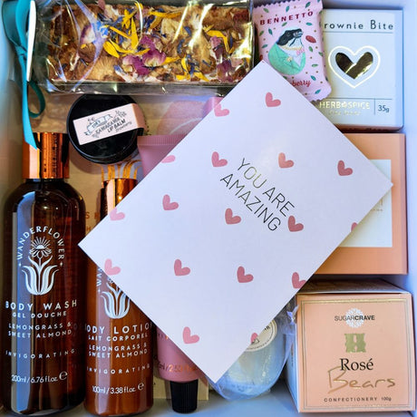 gift box full of luxry treats for womans anniversary gift with a you are amazing card